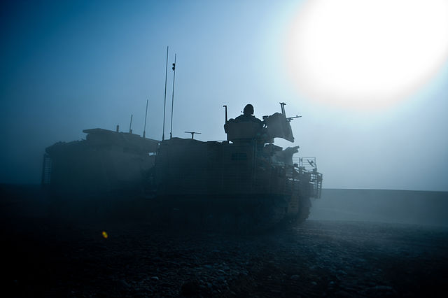A Warthog Armoured Vehicle is silhouetted in the early morning Afghanistan sun. Photo: Corporal Andy Reddy RLC